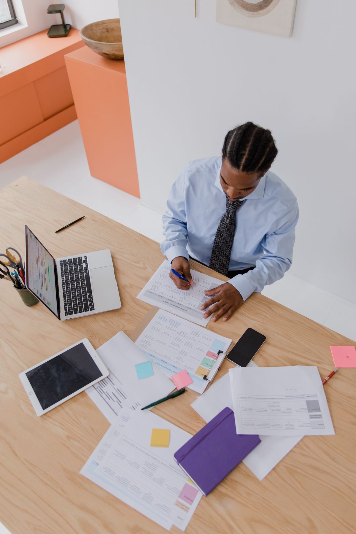 Executive reviewing documents at a desk